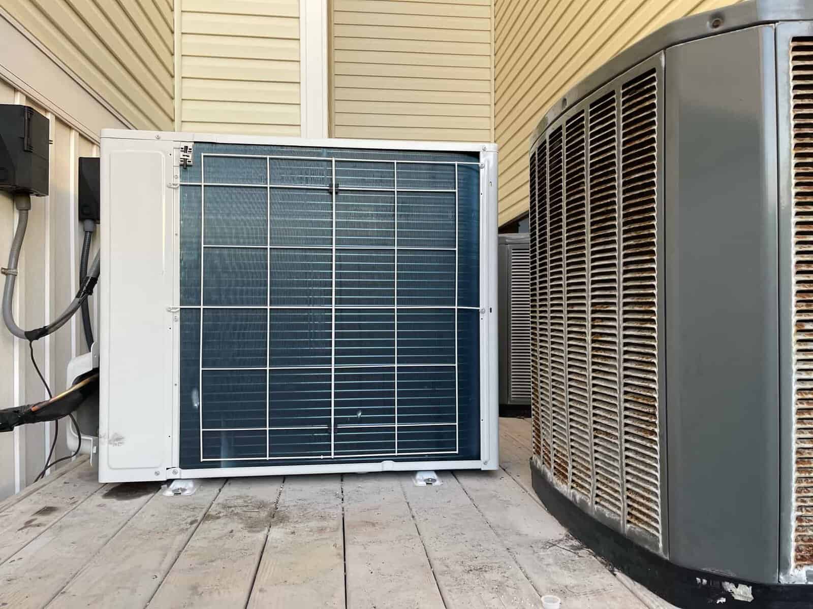 Commercial HVAC outdoor units on rooftop for cooling and heating.