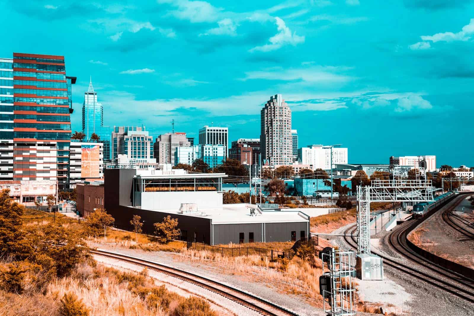 a view of a city from a train track