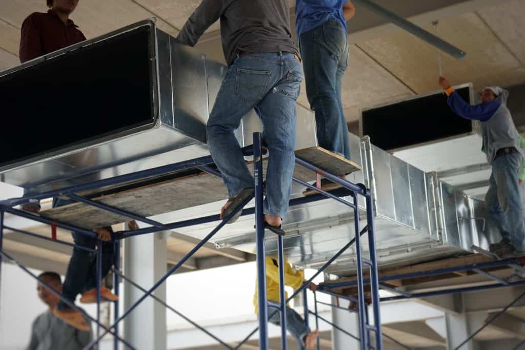 Workers install ventilation ducting in building co 2026 09 22 17 55 30 utc